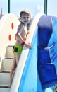 Boy climbing water slide Royalty Free Stock Photo