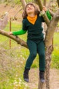 Boy climbs tree looking up Royalty Free Stock Photo