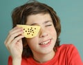 Boy close up photo with piece of cheese