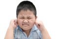 Boy closes ears with fingers to protect from loud noise Royalty Free Stock Photo