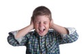 The boy closes ears hands Royalty Free Stock Photo