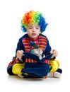 Boy clown with kitten inside hat Royalty Free Stock Photo