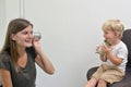 Boy with Cochlear Implants Playing Tin Can Phone Royalty Free Stock Photo