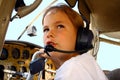 Boy in cockpit of private airplane Royalty Free Stock Photo