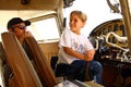 Boy in cockpit of private airplane Royalty Free Stock Photo