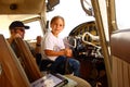 Boy in cockpit of private airplane Royalty Free Stock Photo