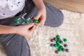The boy collects from the constructor a model of the molecule of sodium chloride, salt according to the formula. Layout Royalty Free Stock Photo