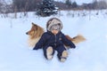 Boy and collie rought in the snow Royalty Free Stock Photo