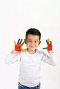 Boy with colorful painted hands Royalty Free Stock Photo