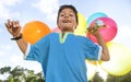 Boy with colourful balloons outdoor