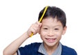 Boy combs his hair by yellow comb