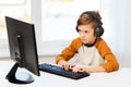 Boy with computer and headphones at home Royalty Free Stock Photo