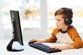 Boy with computer and headphones at home Royalty Free Stock Photo