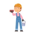 Boy Construction Worker with Bucket and Brick, Cute Little Builder Character Wearing Blue Overalls and Hard Hat with