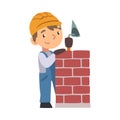 Boy Construction Worker Laying Bricks in Wall with Trowel, Cute Little Builder Character Wearing Blue Overalls and Hard Royalty Free Stock Photo