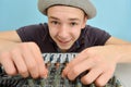 The boy controls the equalizer on the mixing console in the music studio Royalty Free Stock Photo
