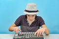 A boy controls a mixing console in a music studio Royalty Free Stock Photo