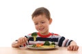 Boy and cooked vegetables