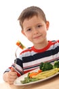 Boy and cooked vegetables