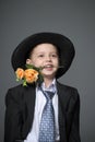 Boy in costume with flowers