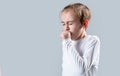Boy coughing sick colds sneezing cough. Child got sick with a virus. Children coughs. Child is ill, he coughs. Treatment