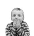 Boy covering his mouth Royalty Free Stock Photo