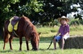Boy with cowboy hat and pony horse Royalty Free Stock Photo