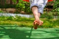 Boy crossed his bare feet. Closeup of feet happy kid sitting and swinging, sunny summer day, countryside background. Child feet Royalty Free Stock Photo