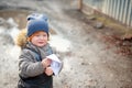 The boy is crying his paper boat