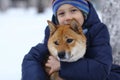 Boy and cute dog on winter walking