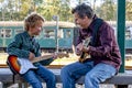 Boy and dad with guitars Royalty Free Stock Photo