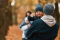 Boy is on the dad's hands. Father with his son on hands walking with mother that is with toddler Royalty Free Stock Photo