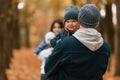 Boy is on the dad's hands. Father with his son on hands walking with mother that is with toddler Royalty Free Stock Photo