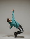 Boy dancing contemporary dance in studio. Acrobatic dancer. Royalty Free Stock Photo