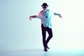 Boy dancing contemporary dance in studio. Breakdancing. Royalty Free Stock Photo