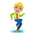 Boy Dancing Splashing Water, Kid In Autumn Clothes In Fall Season Enjoyingn Rain And Rainy Weather, Splashes And Puddles Royalty Free Stock Photo