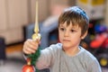 The boy decorates the Christmas tree. Children in Xmas Royalty Free Stock Photo