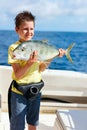 Boy deep sea fishing Royalty Free Stock Photo