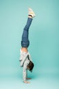 boy in denim jeans doing handstand Royalty Free Stock Photo