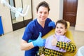 A boy and a dentist man in a dental office . Royalty Free Stock Photo