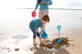 Boy Digging on the Beach