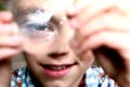 Boy discover characteristics on convex lens