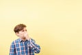 Boy with disgusted face expression covering nose Royalty Free Stock Photo