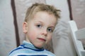 Boy with disheveled hair standing Royalty Free Stock Photo