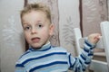 Boy with disheveled hair standing Royalty Free Stock Photo