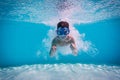 Boy dive in swimming pool Royalty Free Stock Photo