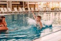 The boy dived into the outdoor pool. Family holidays in the hotel Royalty Free Stock Photo