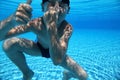 Boy dives under water in pool Royalty Free Stock Photo