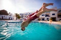 Boy diving in swimming pool Royalty Free Stock Photo