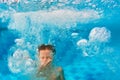 Boy diving in swimming pool Royalty Free Stock Photo